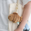 Brown Taiyaki Plush Bag Charm hanging from a tote bag as a cute accessory