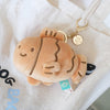 Brown Taiyaki Plush Keychain close-up attached to a canvas bag